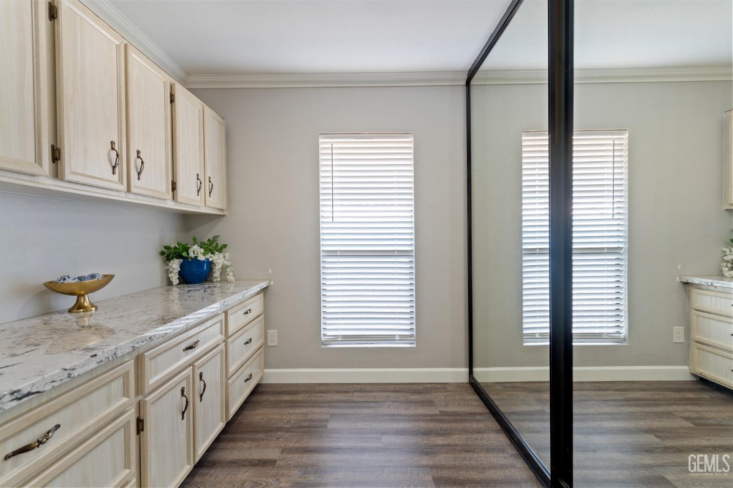 Undisclosed Address Bakersfield, CA 93306 - Photo 13 of 27 a kitchen with granite countertop white cabinets and white appliances