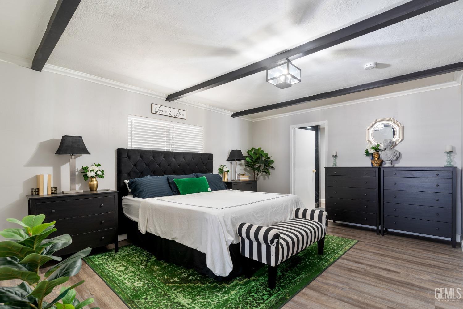 Undisclosed Address Bakersfield, CA 93306 - Photo 14 of 27 a bedroom with a bed and a dresser