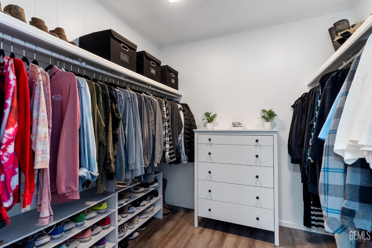 Undisclosed Address Bakersfield, CA 93306 - Photo 15 of 27 a view of walk in closet with clothes