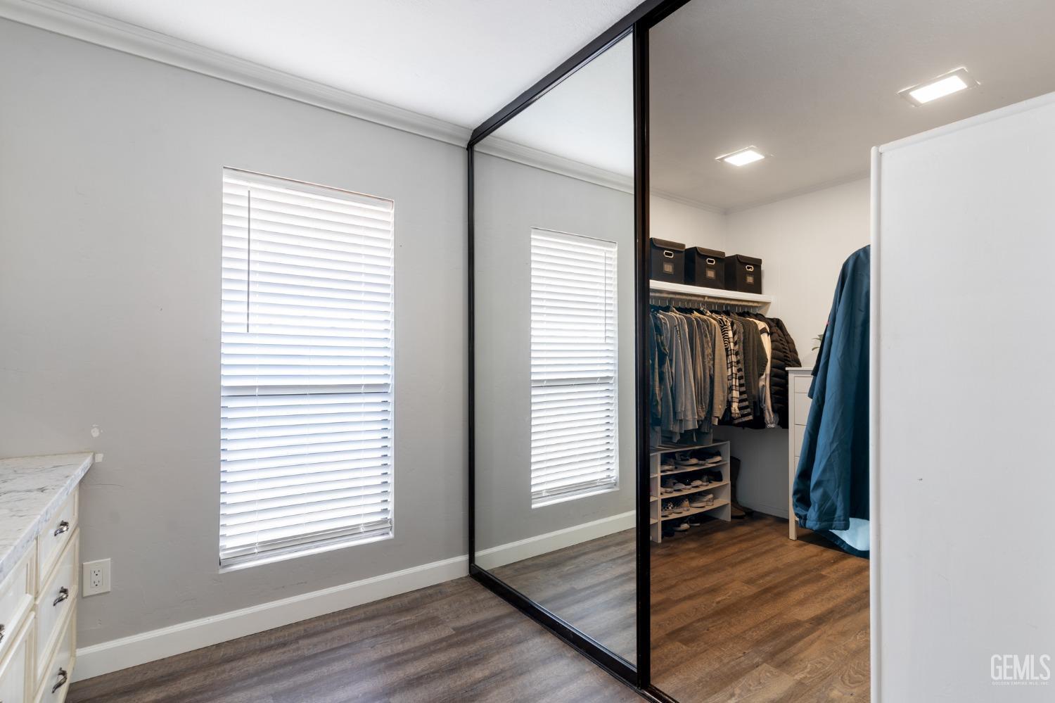 Undisclosed Address Bakersfield, CA 93306 - Photo 16 of 27 a view of a hallway with a kitchen space and a window