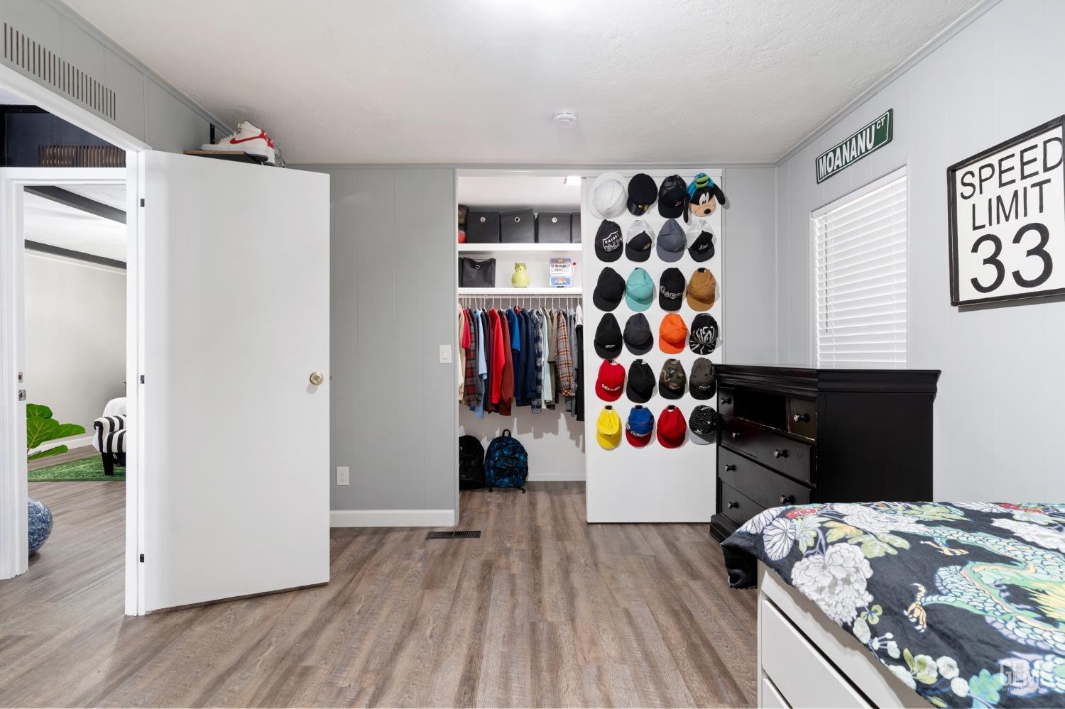 Undisclosed Address Bakersfield, CA 93306 - Photo 18 of 27 a bedroom with a bed and a dresser