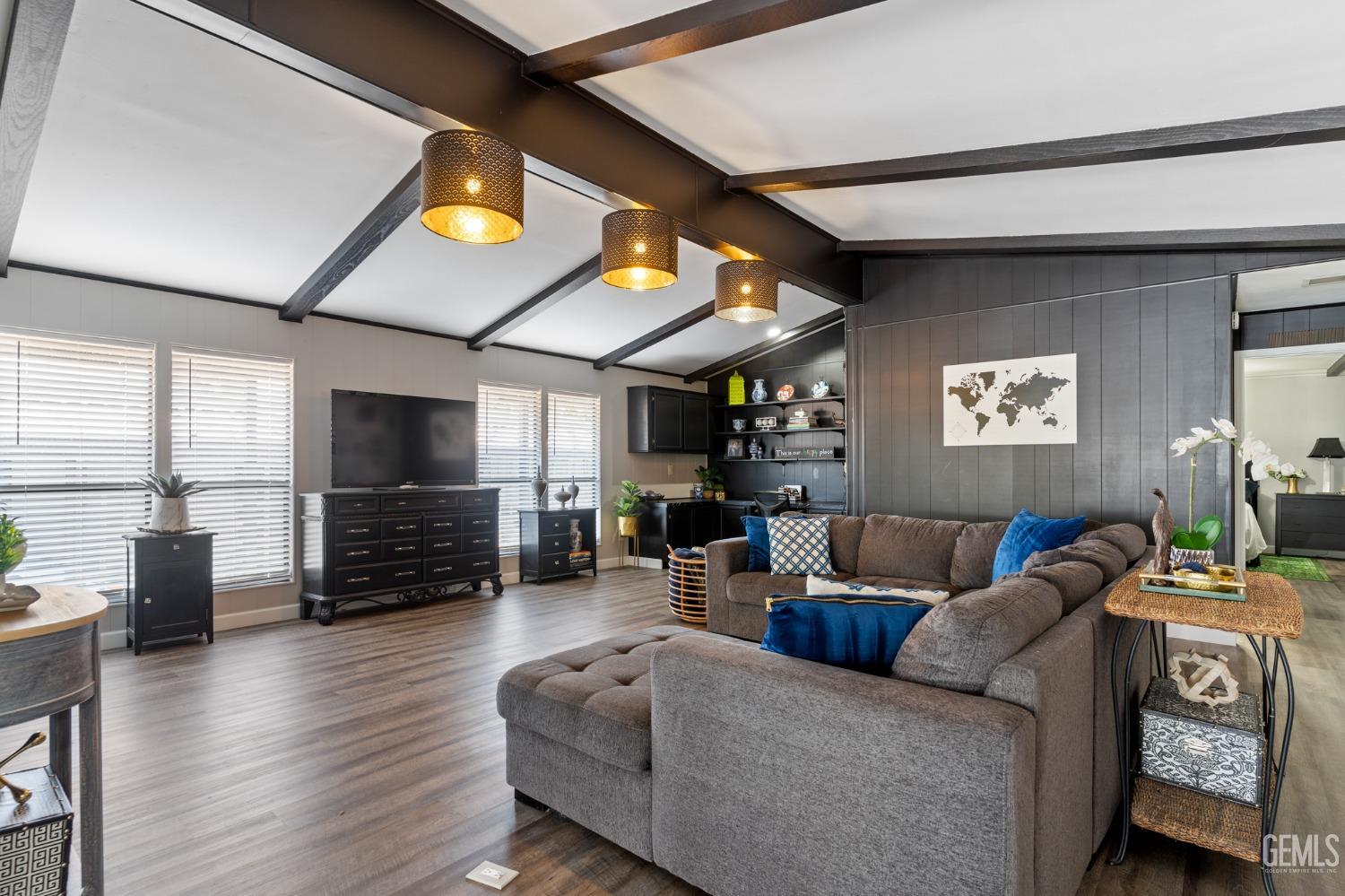 Undisclosed Address Bakersfield, CA 93306 - Photo 2 of 27 a living room with furniture and a flat screen tv
