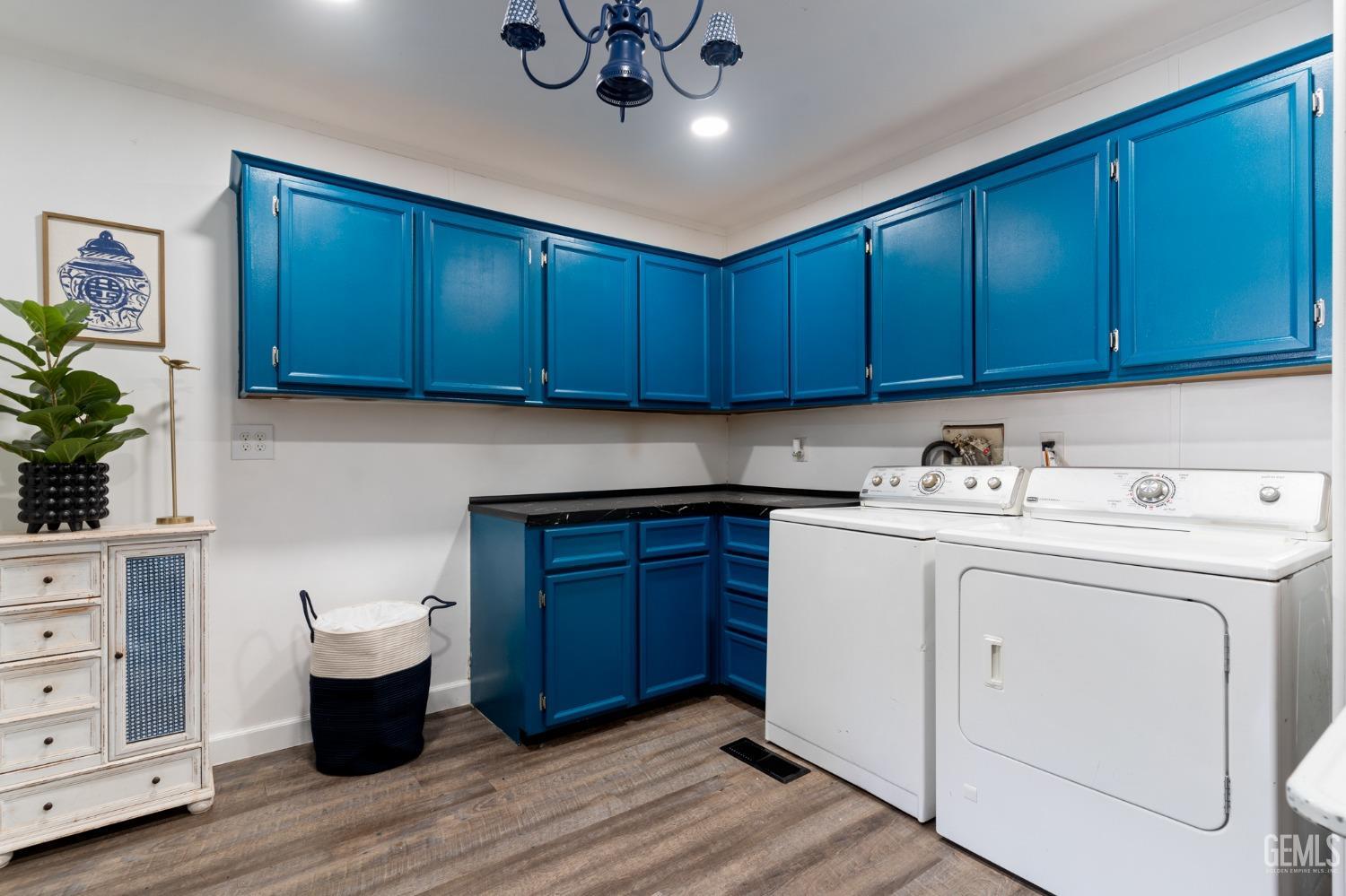 Undisclosed Address Bakersfield, CA 93306 - Photo 23 of 27 a view of a kitchen with cabinets and wooden floor