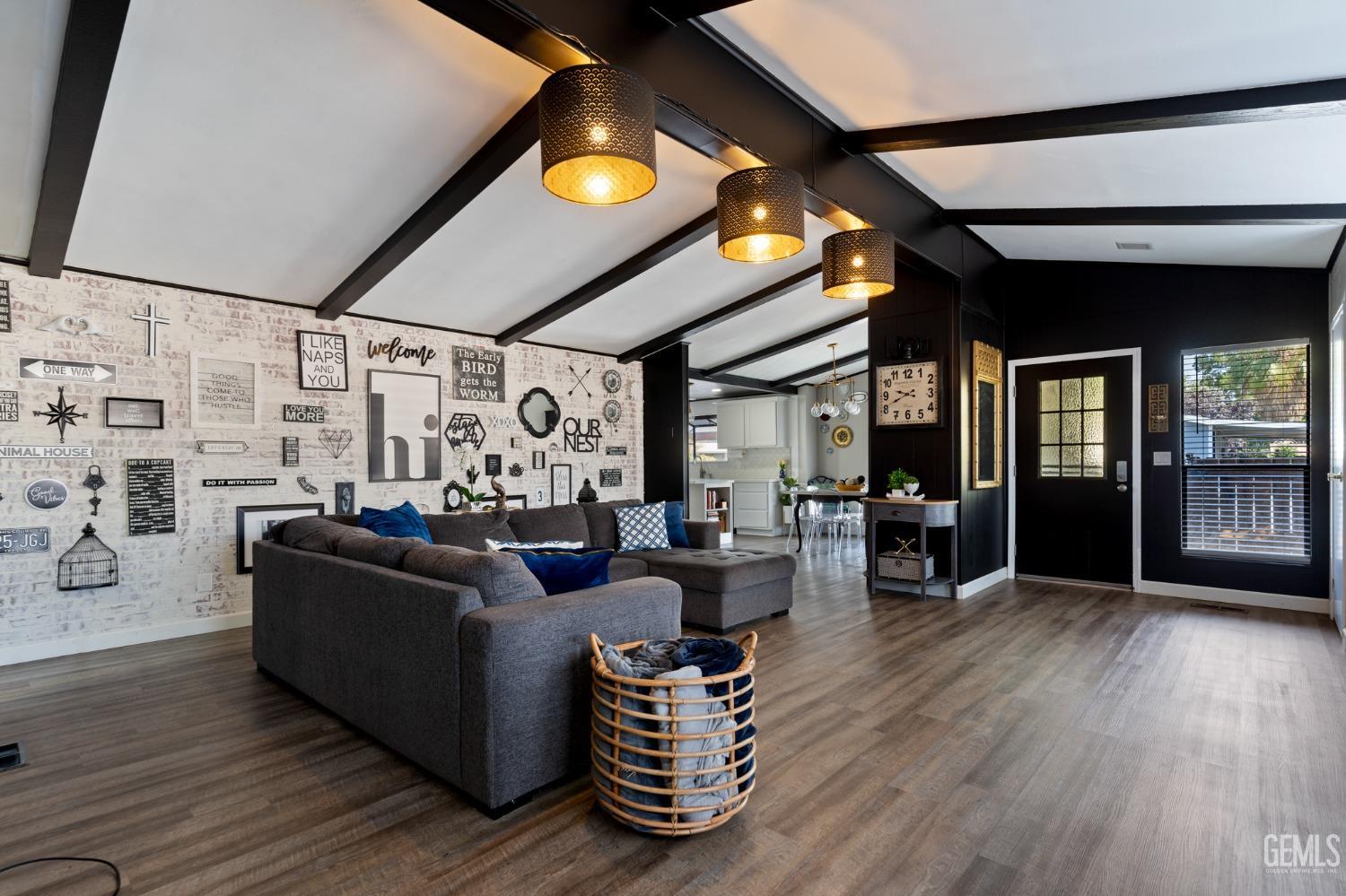 Undisclosed Address Bakersfield, CA 93306 - Photo 3 of 27 a living room with furniture and wooden floor