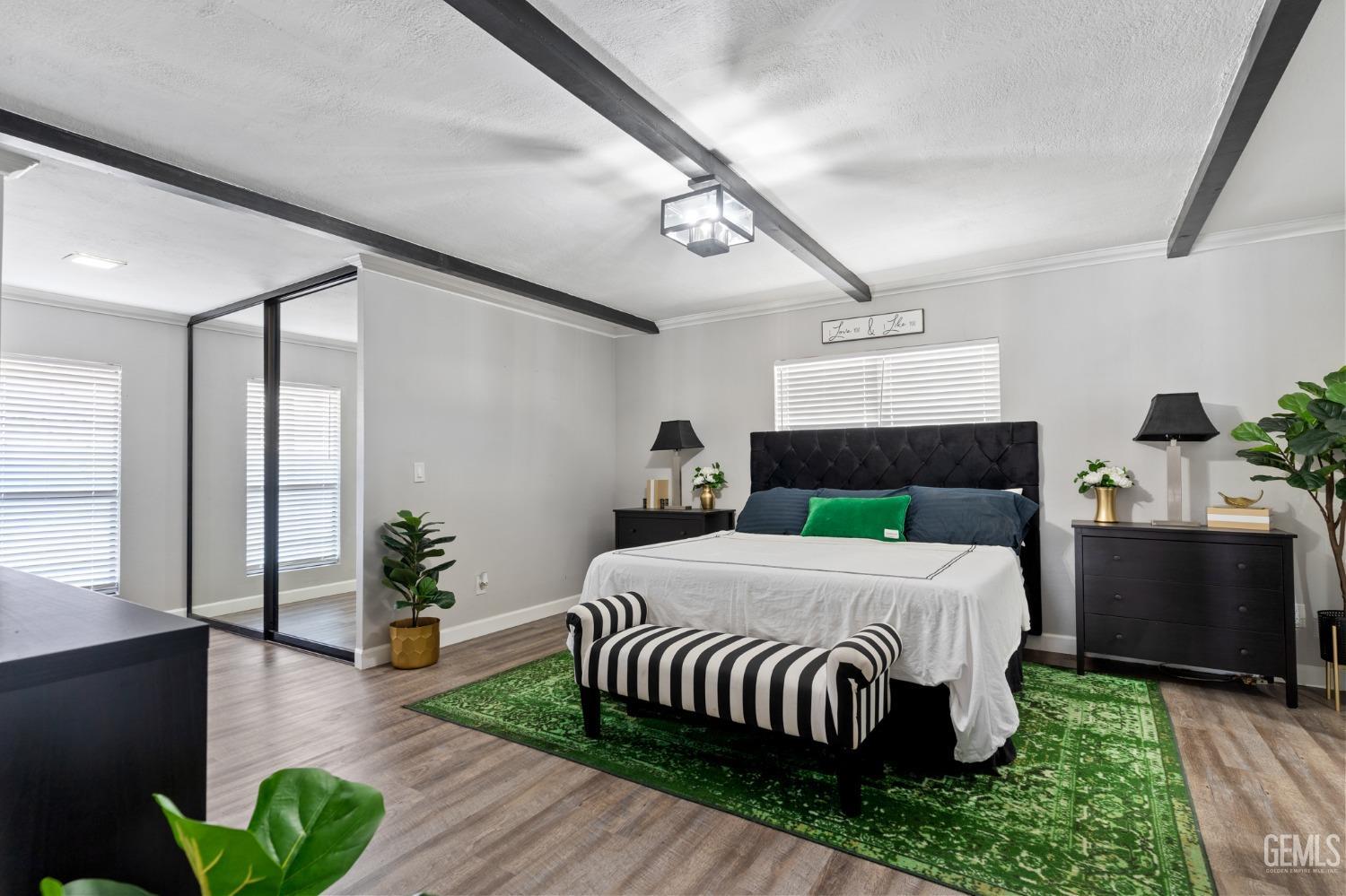 Undisclosed Address Bakersfield, CA 93306 - Photo 4 of 27 a bedroom with a bed table and a potted plant