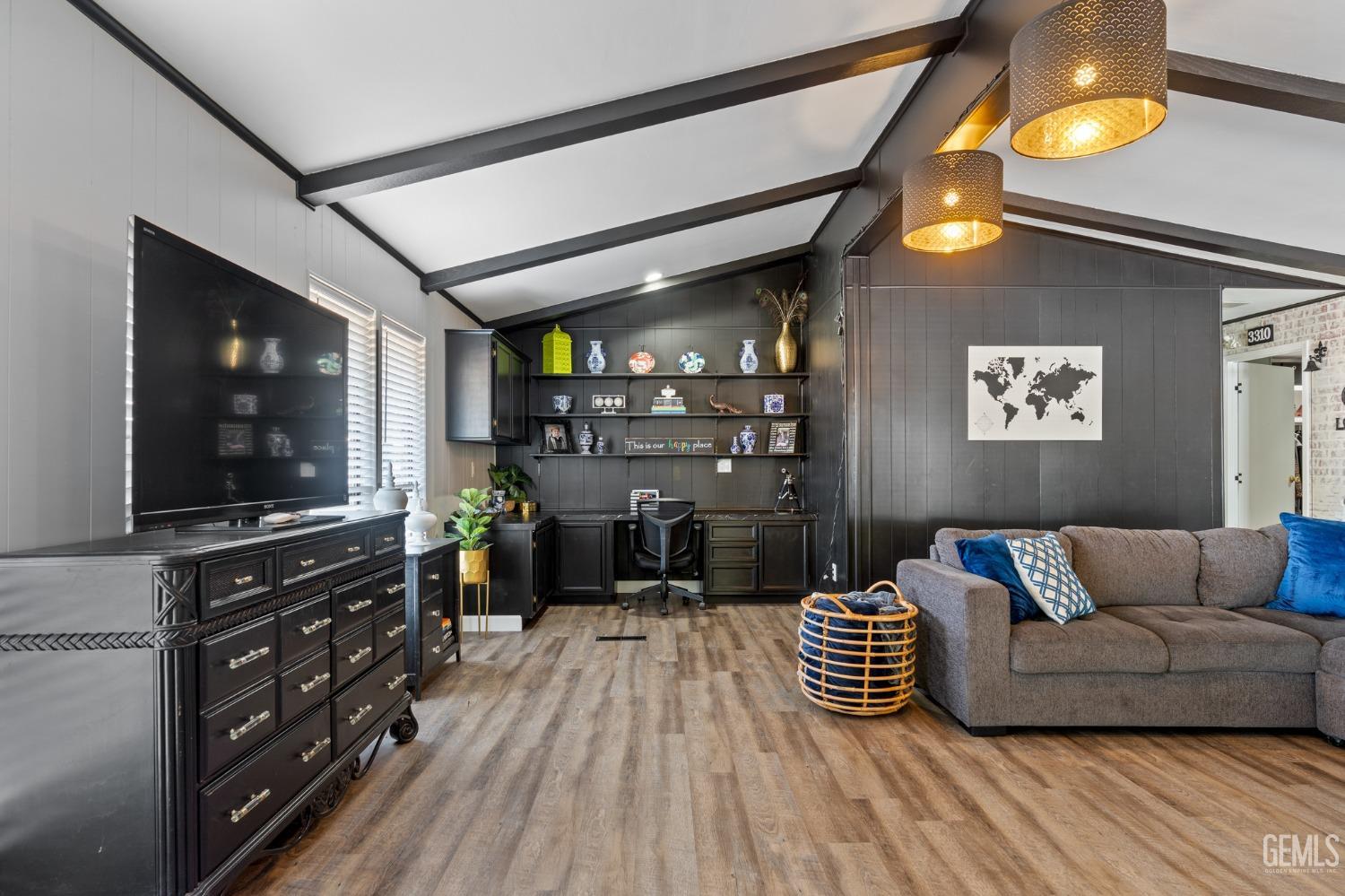 Undisclosed Address Bakersfield, CA 93306 - Photo 6 of 27 a living room with furniture and a flat screen tv