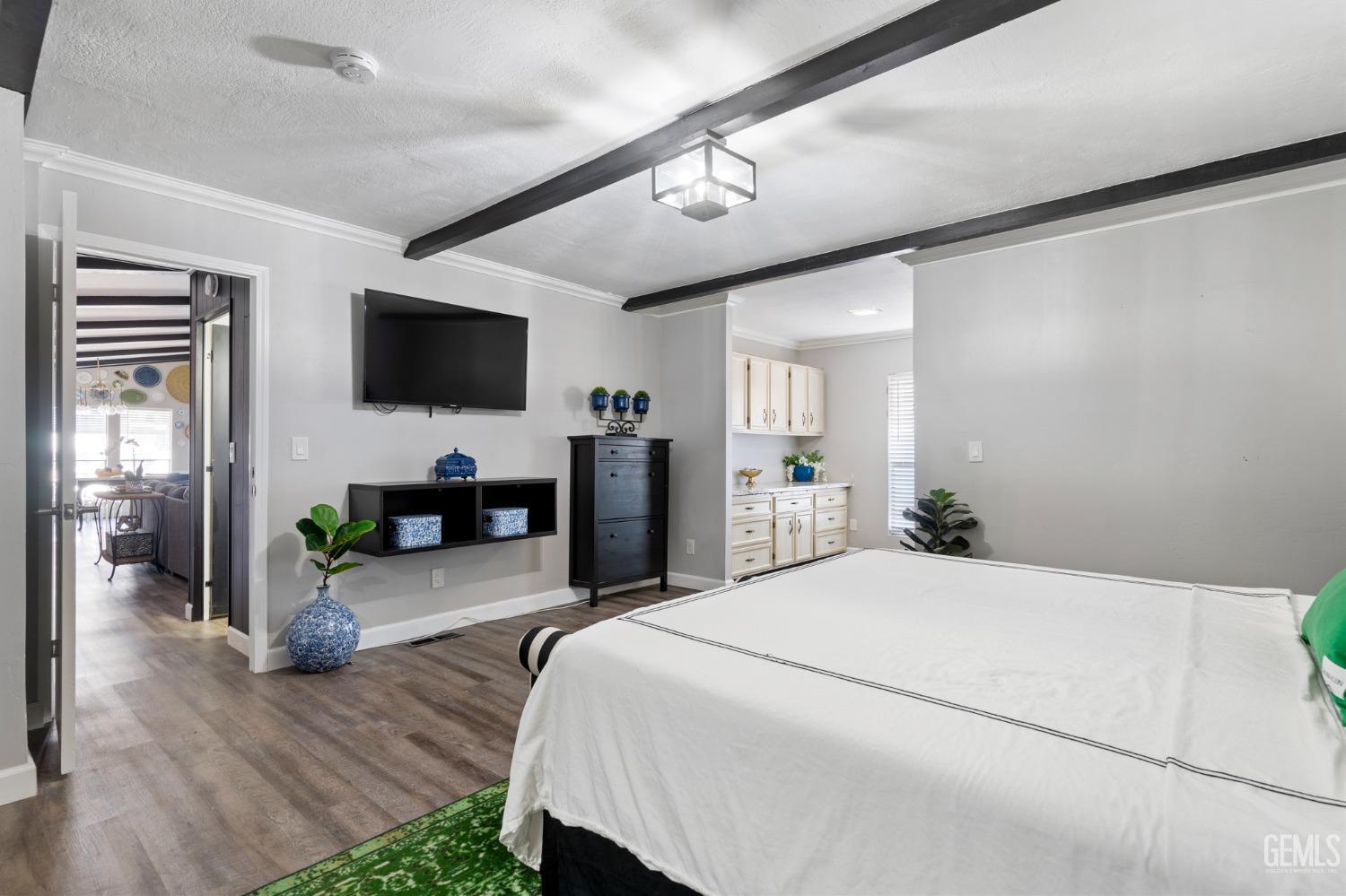 Undisclosed Address Bakersfield, CA 93306 - Photo 8 of 27 a bedroom with a bed and a flat screen tv