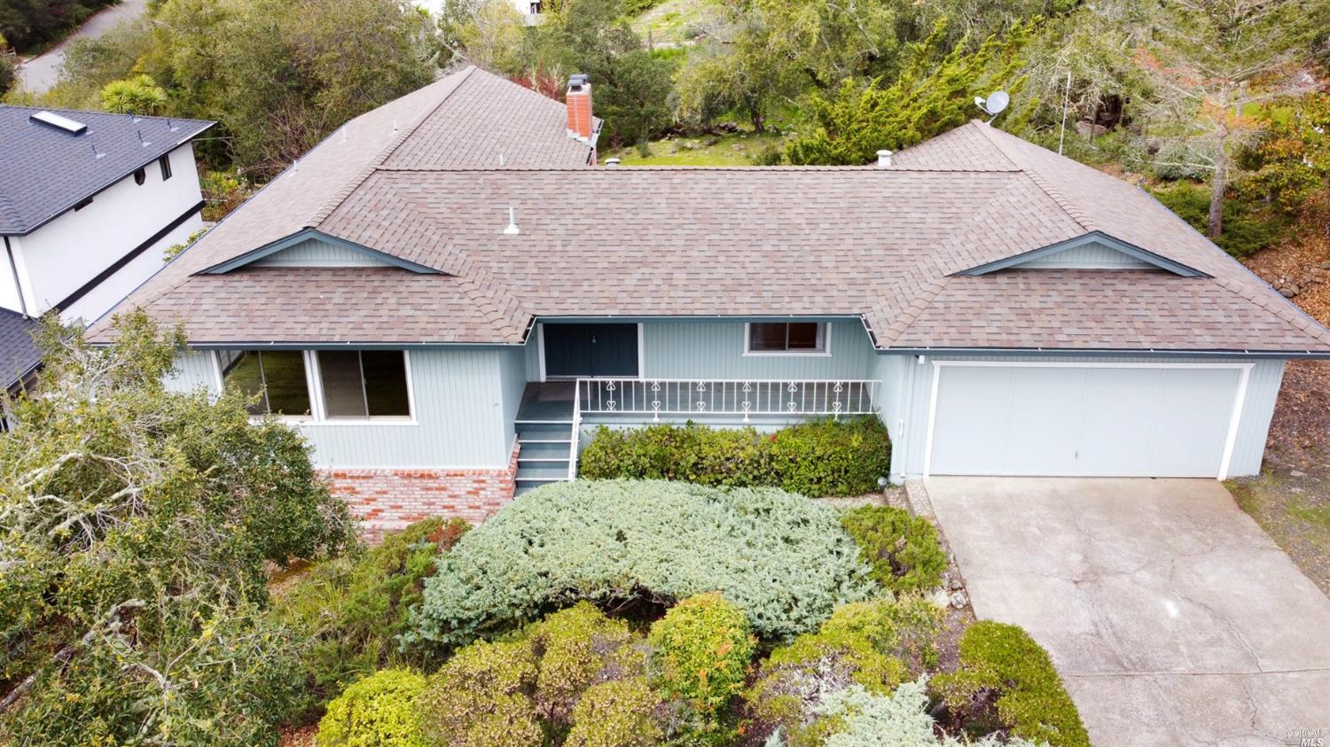 1821 San Ramon Way Santa Rosa, CA 95409 - Photo 1 of 1 a front view of a house with a yard and garage