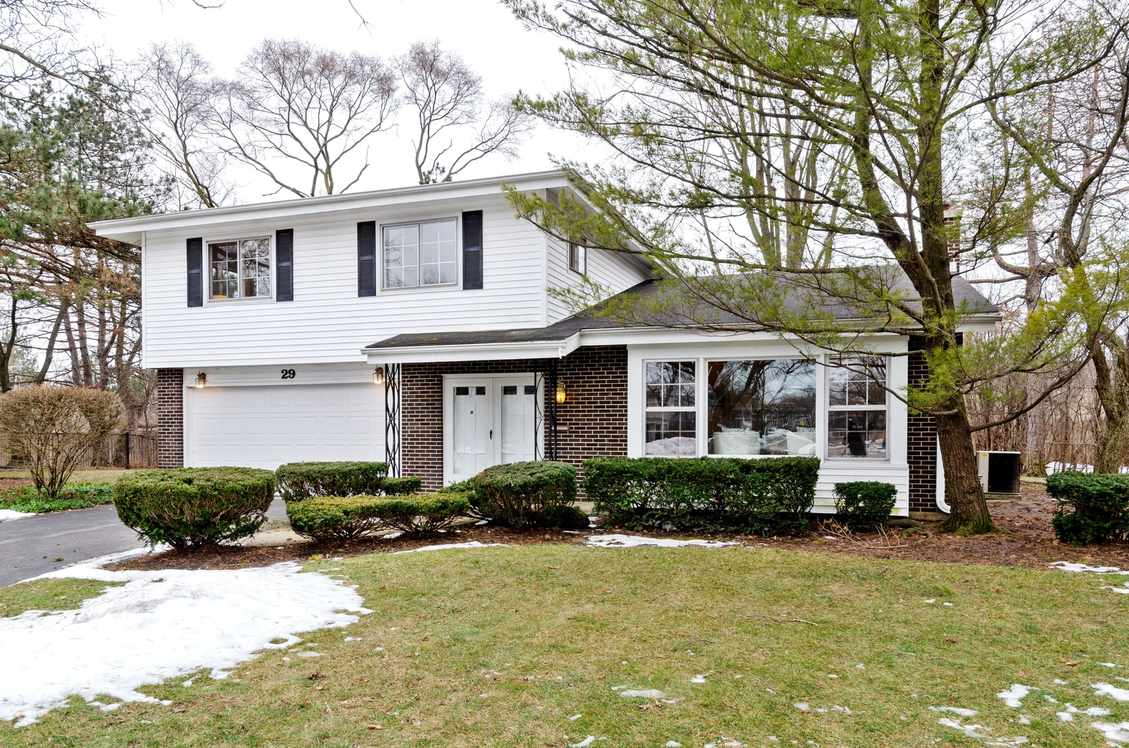 29 Ferndale Road Deerfield, IL 60015 - Photo 1 of 15 a front view of a house with a yard and porch