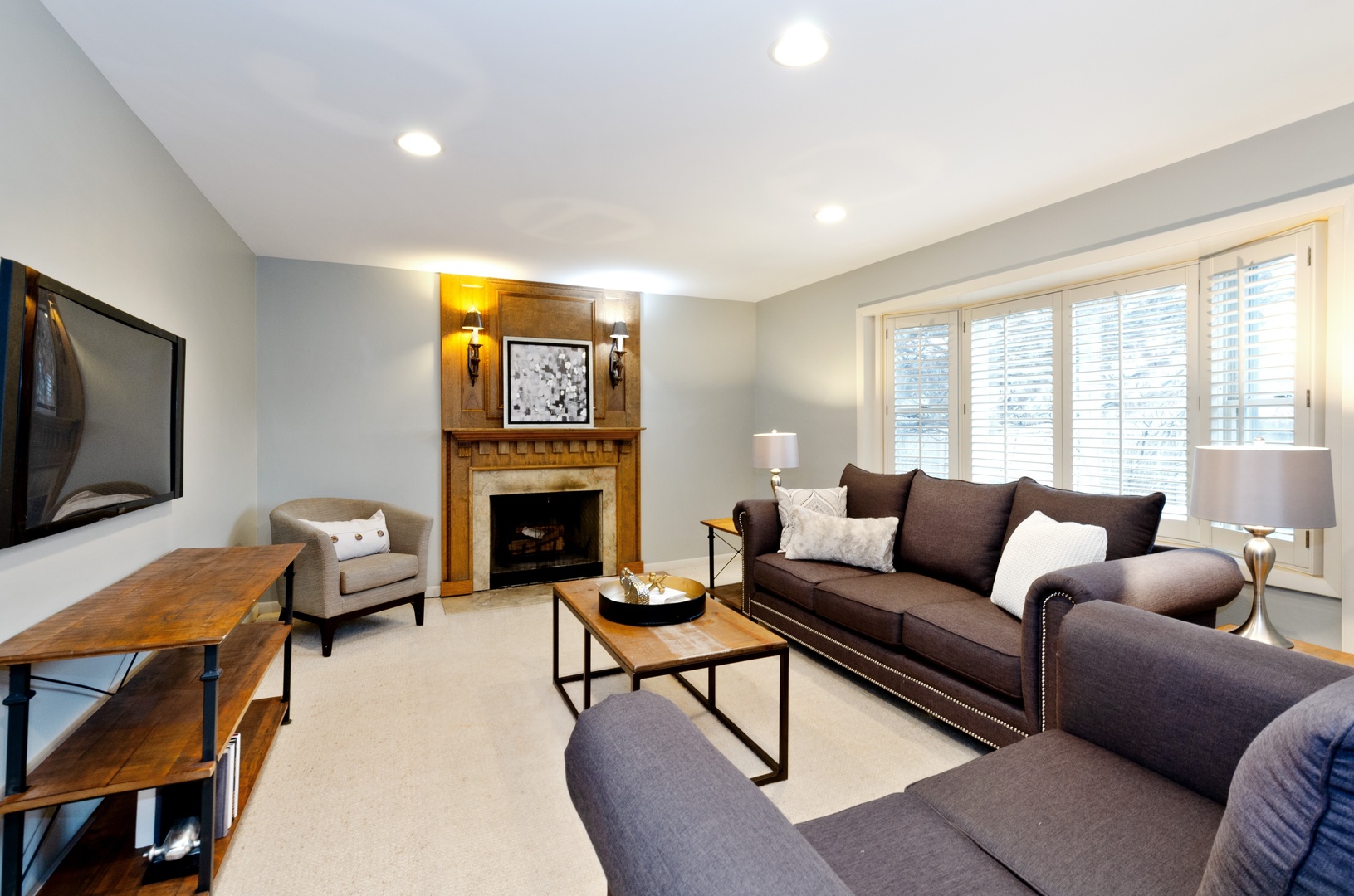 29 Ferndale Road Deerfield, IL 60015 - Photo 7 of 15 a living room with furniture a fireplace and a flat screen tv