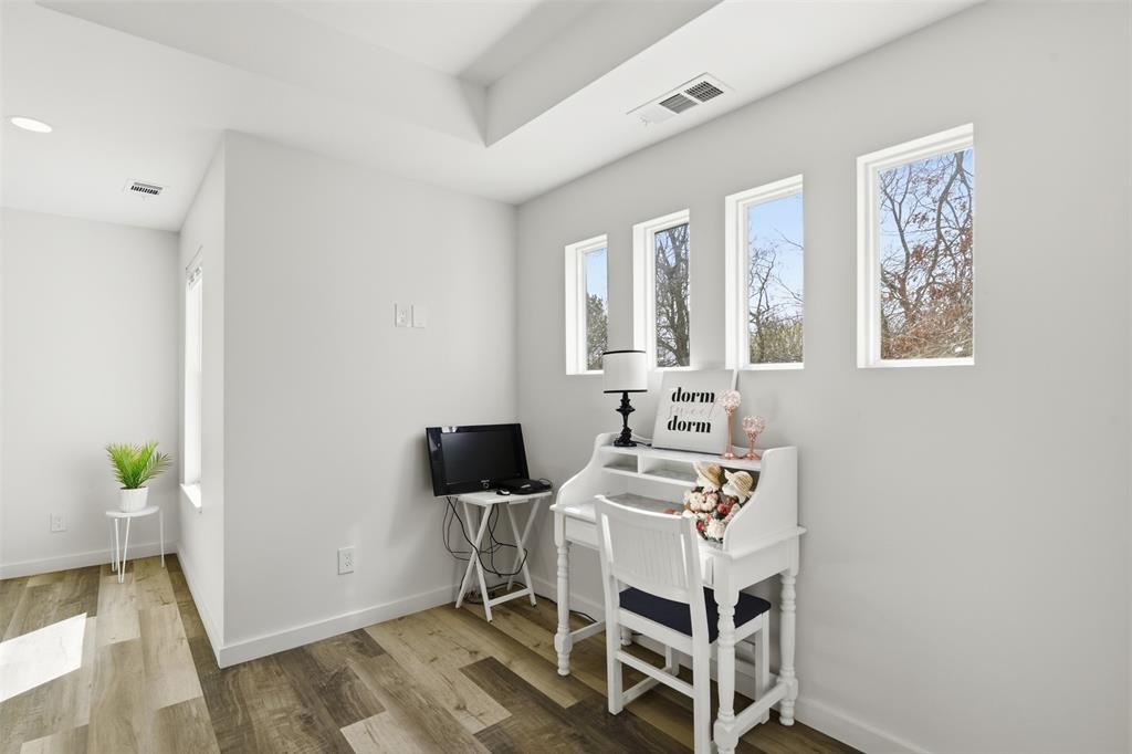 521 York Street Athens, TX 75751 - Photo 21 of 34 a view of a workspace with furniture and wooden floor