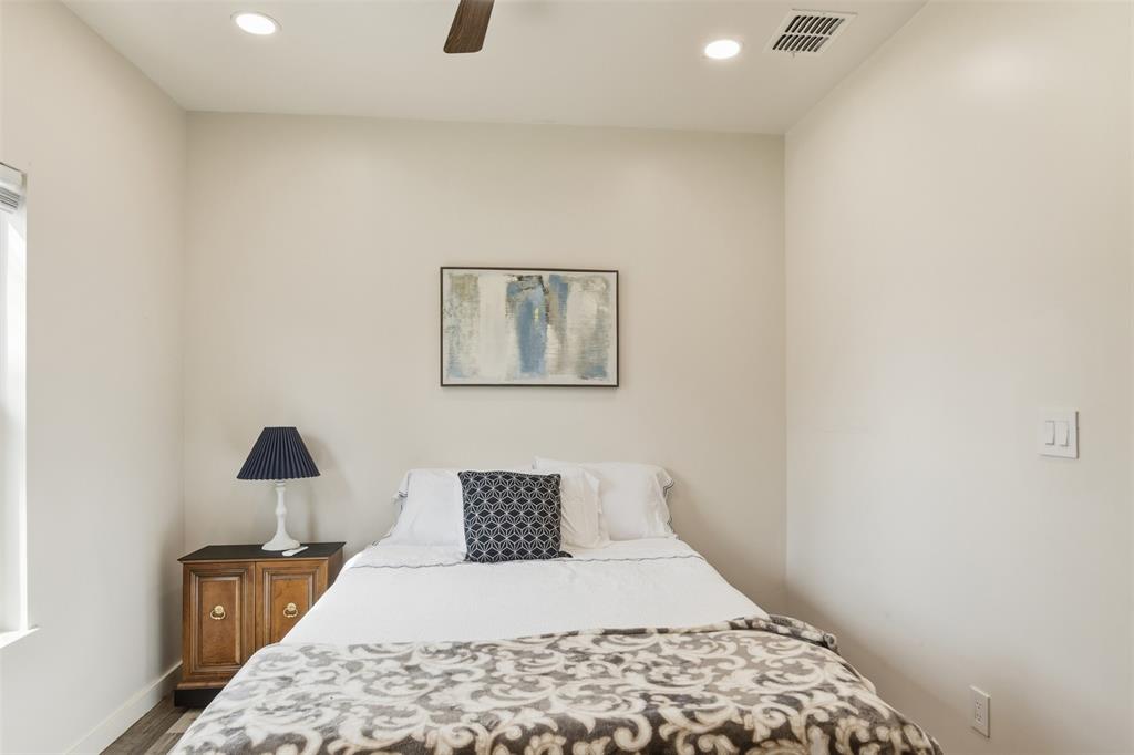 521 York Street Athens, TX 75751 - Photo 22 of 34 a bedroom with a bed and a lamp
