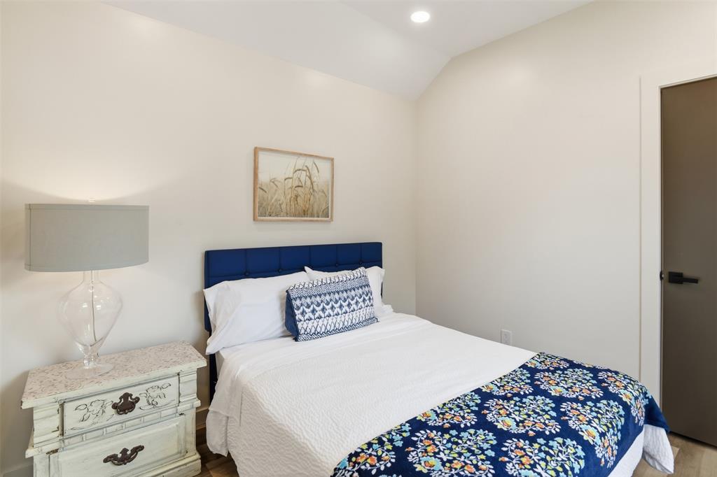 521 York Street Athens, TX 75751 - Photo 24 of 34 a bedroom with a bed and a painting on the wall