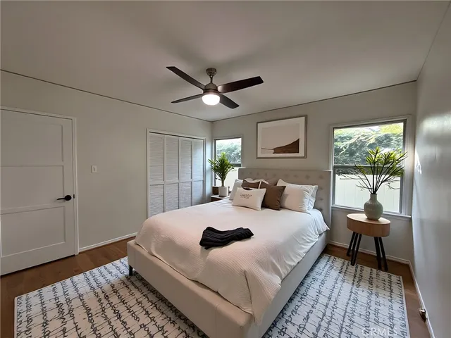 a bedroom with a bed and a table in it
