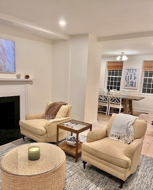 76 Orange Street Nantucket, MA 02554 - Photo 11 of 34 a living room with furniture and a fireplace