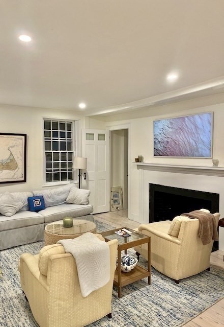 76 Orange Street Nantucket, MA 02554 - Photo 12 of 34 a living room with furniture and a fireplace