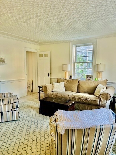 76 Orange Street Nantucket, MA 02554 - Photo 14 of 34 a bedroom with a bed and a couch