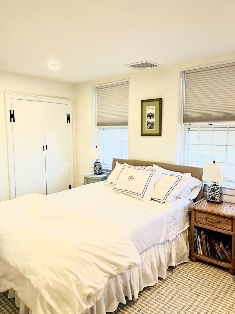 76 Orange Street Nantucket, MA 02554 - Photo 16 of 34 a bedroom with a bed and a night stand
