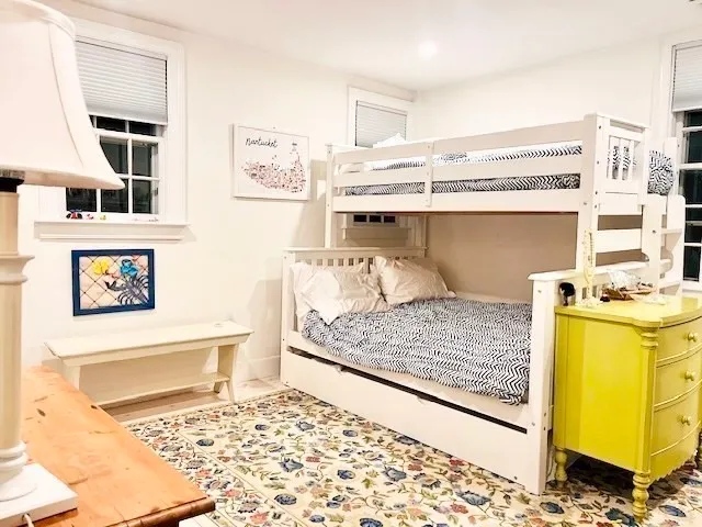 a living room with a couch and dresser