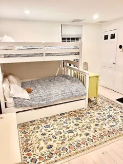 a view of a living room and kitchen with a sink