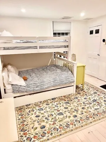 a view of a living room and kitchen with a sink