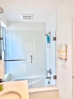 a bathroom with a bathtub and a shower