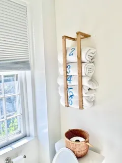 a bathroom with a toilet and a shower curtain