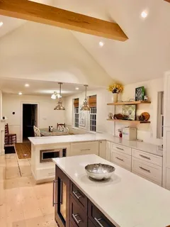 a kitchen with a stove a sink and cabinets