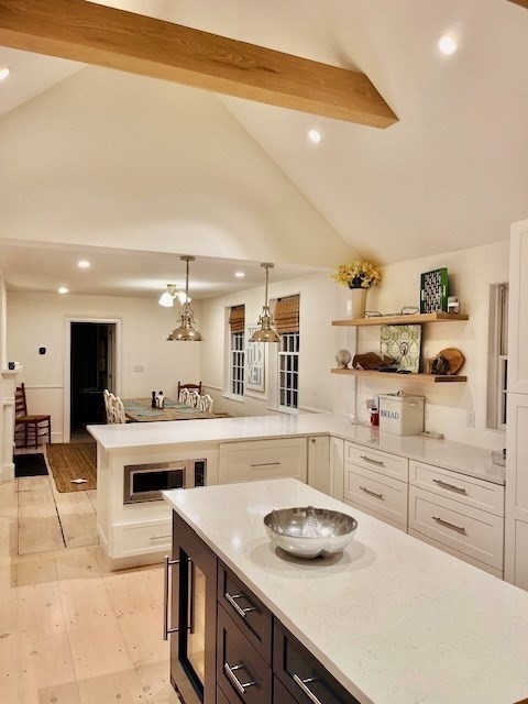 76 Orange Street Nantucket, MA 02554 - Photo 7 of 34 a kitchen with a stove a sink and cabinets