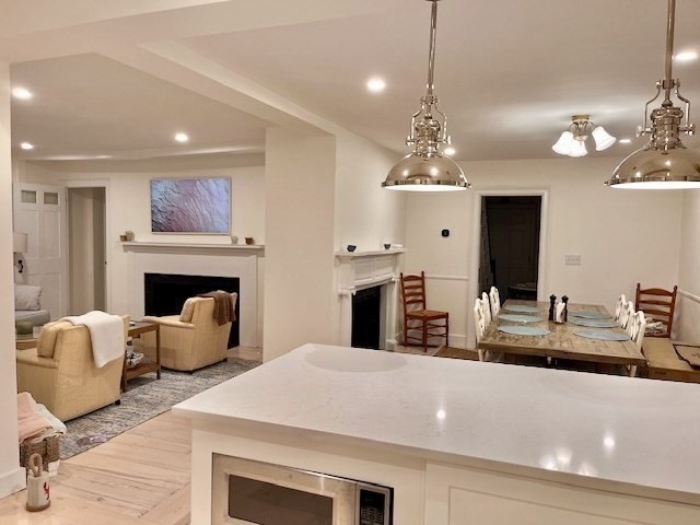 76 Orange Street Nantucket, MA 02554 - Photo 9 of 34 a room with furniture and a fireplace