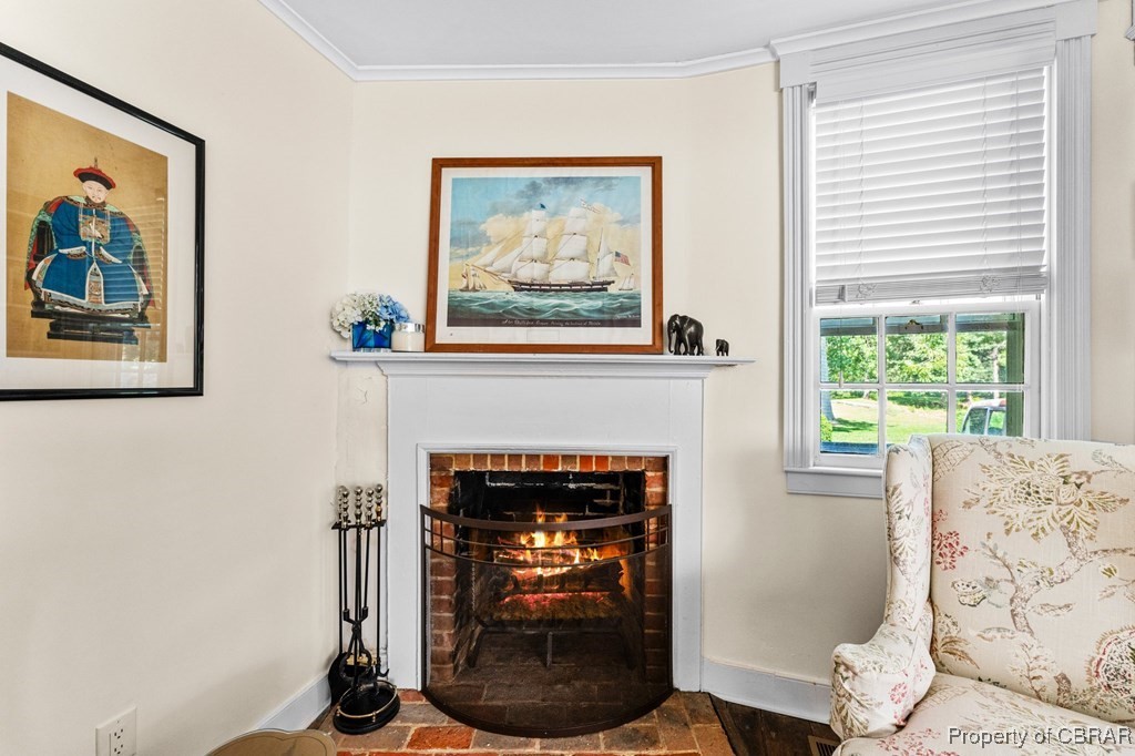 1701 Balls Neck Road Kilmarnock, VA 22482 - Photo 39 of 50 Sitting room featuring a fireplace and crown molding