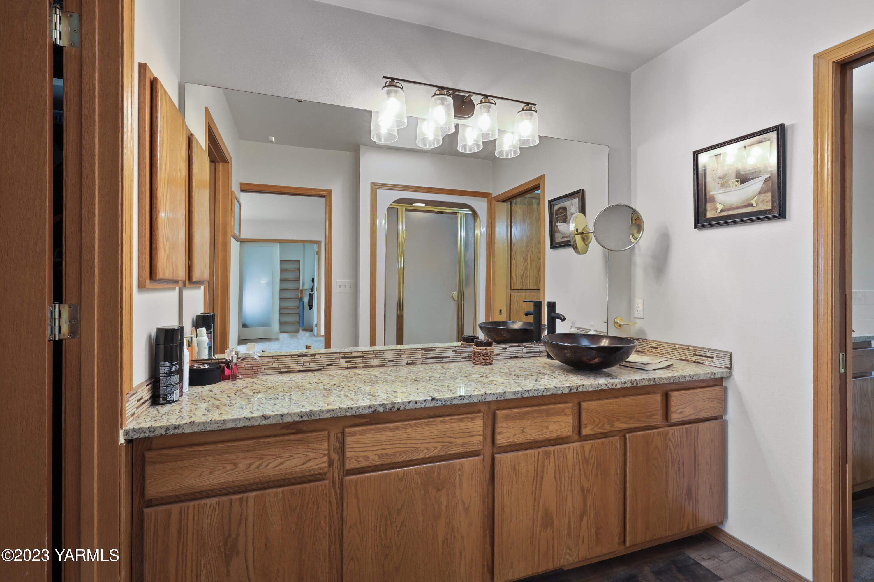 380 Wilson Road Yakima, WA 98901 - Photo 18 of 28 a bathroom with a granite countertop sink and a mirror