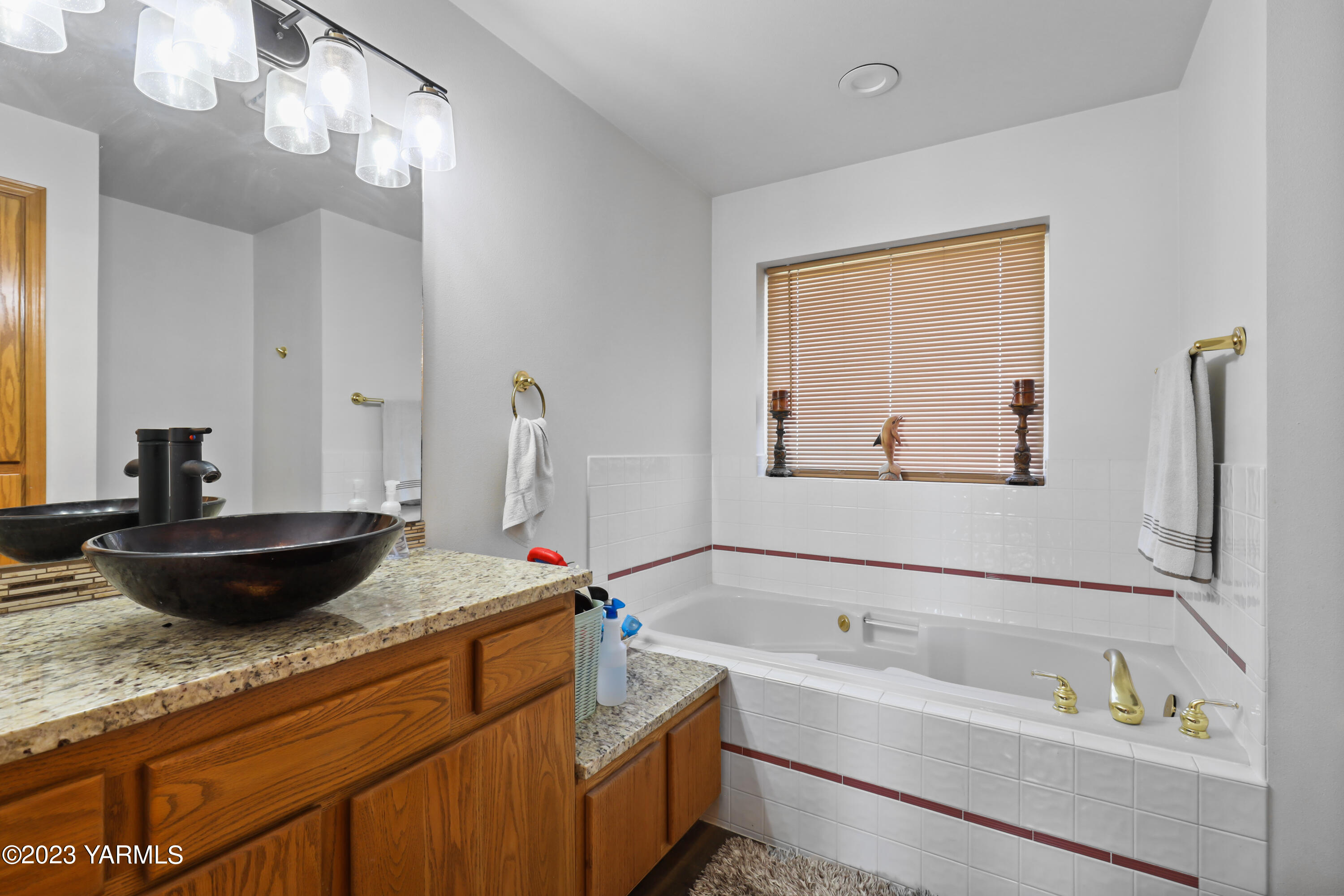 380 Wilson Road Yakima, WA 98901 - Photo 19 of 28 a kitchen with a sink and wooden floor