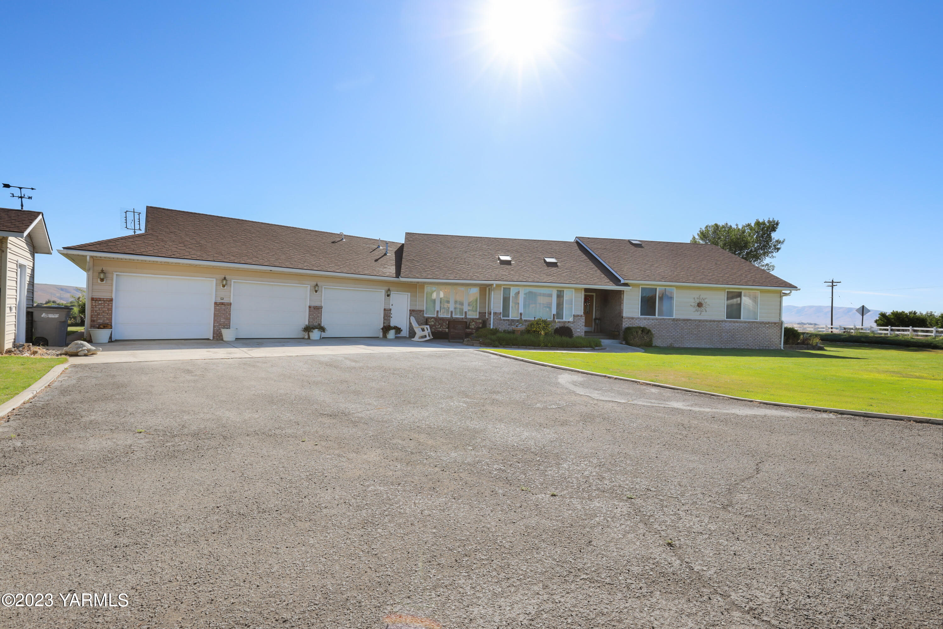 380 Wilson Road Yakima, WA 98901 - Photo 2 of 28 a view of a house with a big yard and large trees