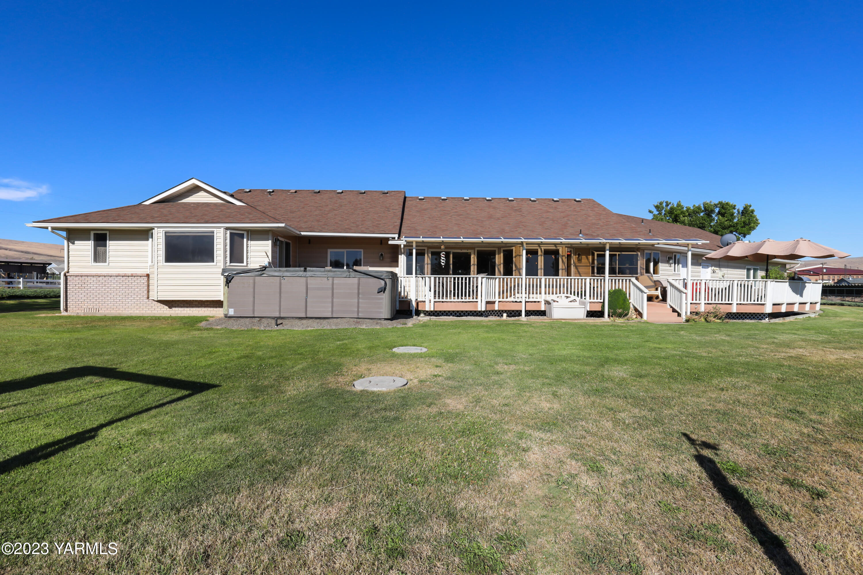 380 Wilson Road Yakima, WA 98901 - Photo 26 of 28 a front view of a house with a yard table and chairs