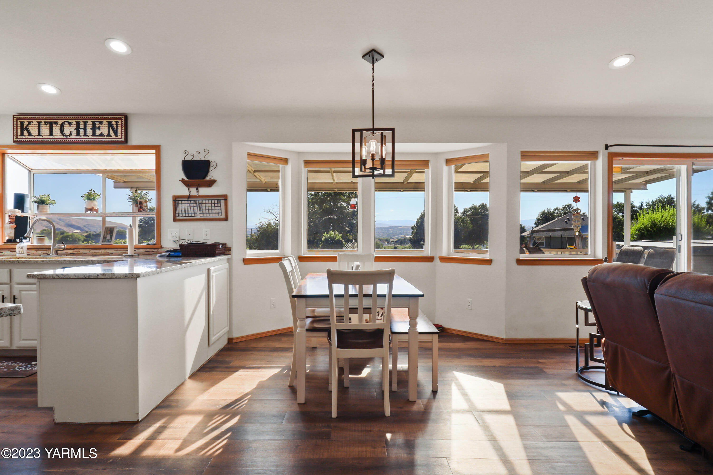 380 Wilson Road Yakima, WA 98901 - Photo 5 of 28 a dining room with furniture window wooden floor
