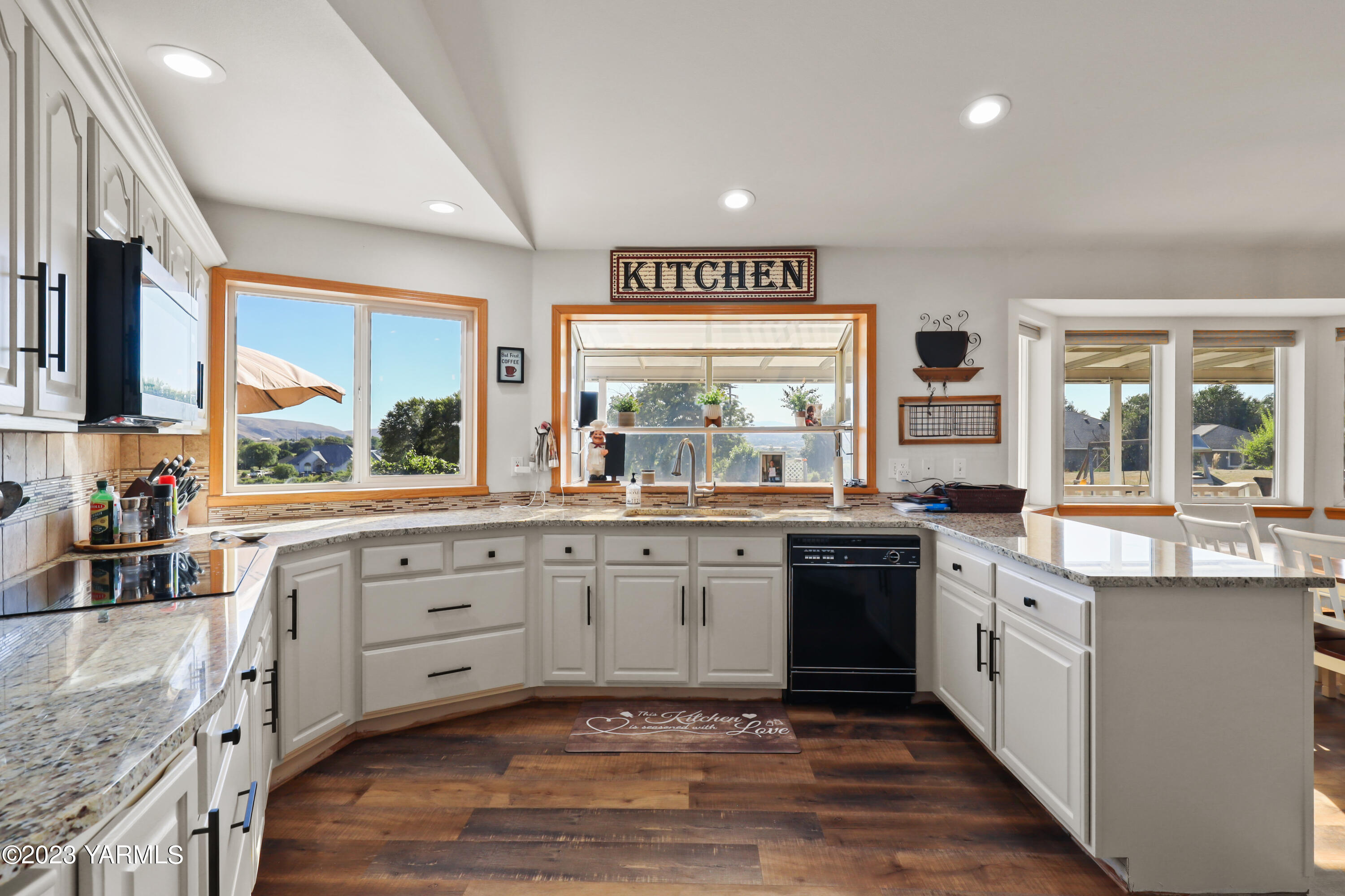 380 Wilson Road Yakima, WA 98901 - Photo 7 of 28 a large kitchen with stainless steel appliances granite countertop a stove and a sink