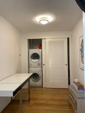 a view of a storage & utility room with washer and dryer