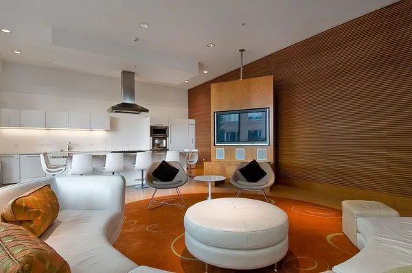 a living room with furniture and a lamp