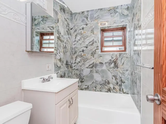 a bathroom with a sink and a bathtub