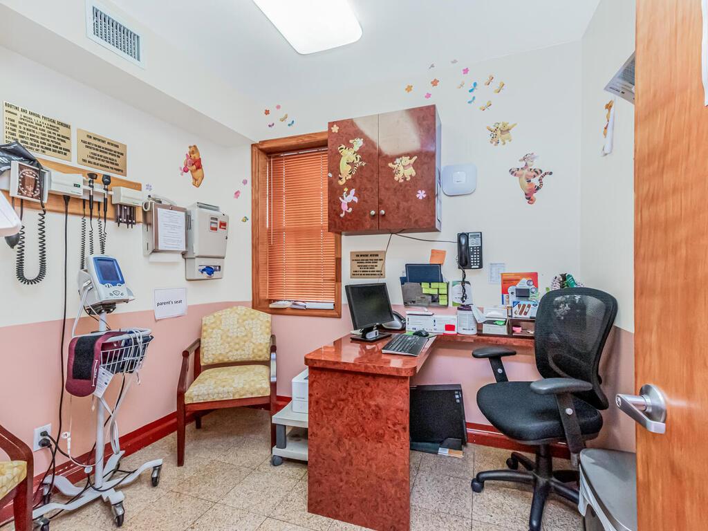 57-07 146th Street Queens, NY 11355 - Photo 7 of 19 a living room with furniture and a fireplace
