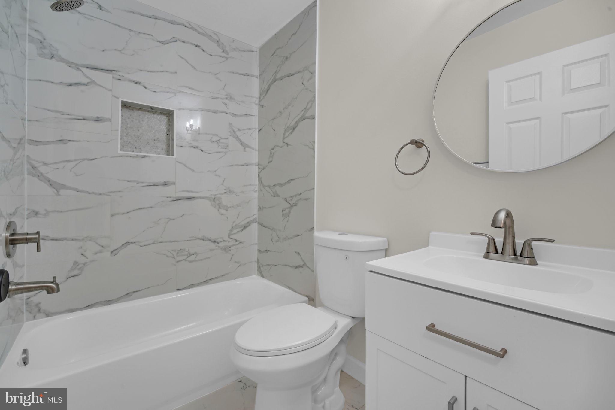 8613 Weems Road Manassas, VA 20110 - Photo 7 of 50 a bathroom with a sink a toilet and bathtub