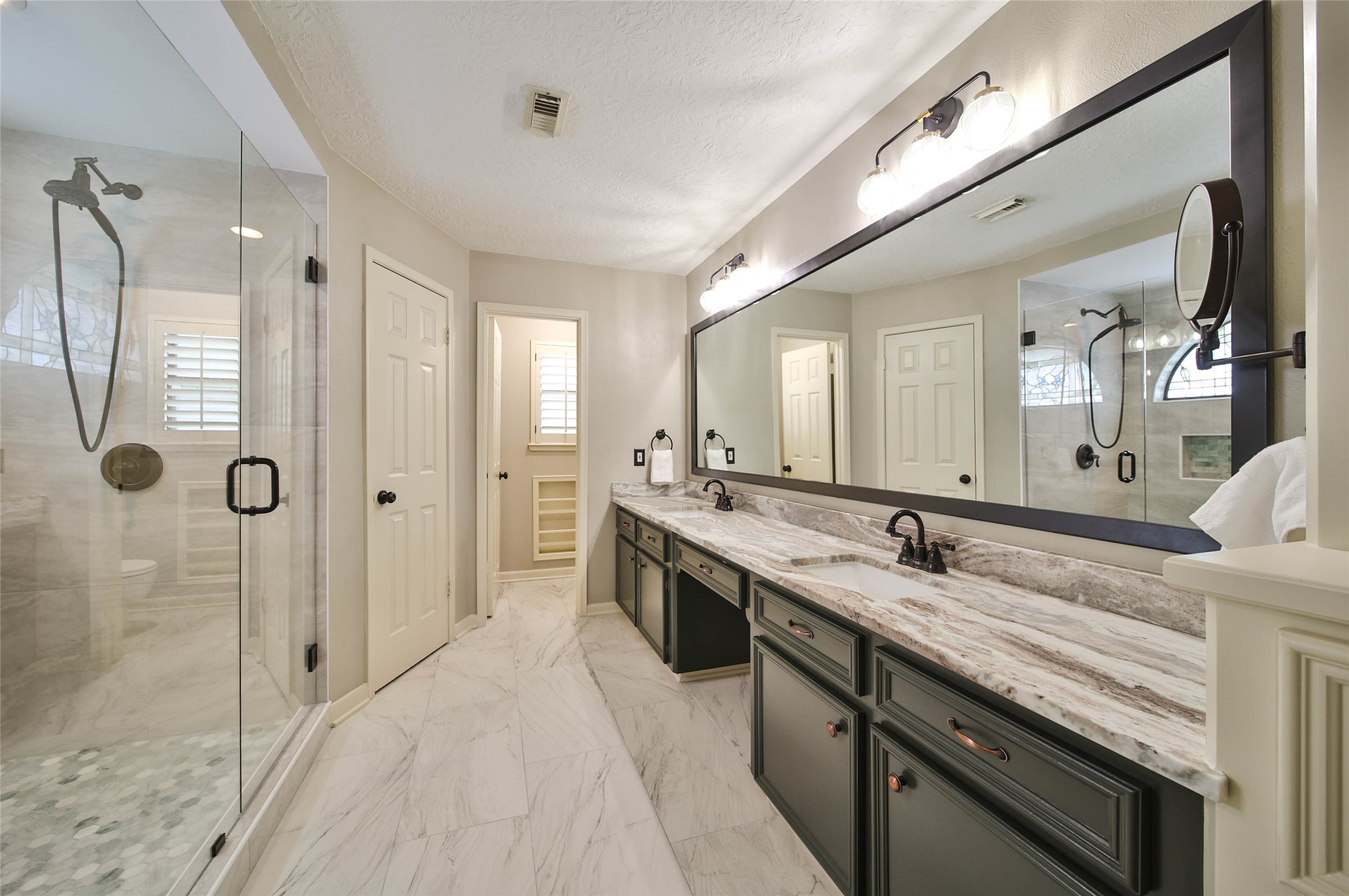 17007 Windrow Drive Spring, TX 77379 - Photo 22 of 46 a spacious bathroom with a granite countertop sink mirror and double