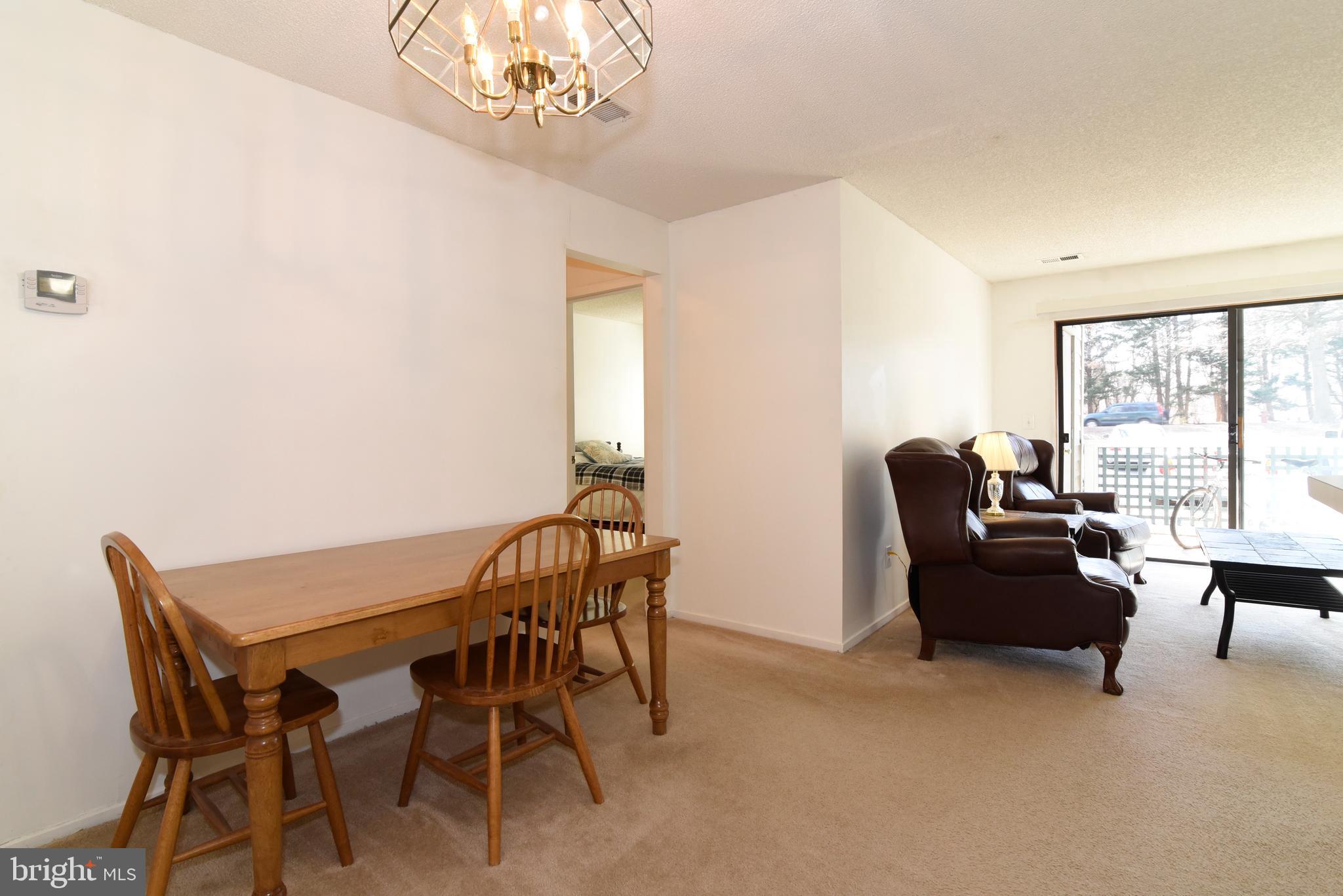 11705 Summerchase Circle, Unit 1705A Reston, VA 20194 - Photo 9 of 36 Dining room and living room