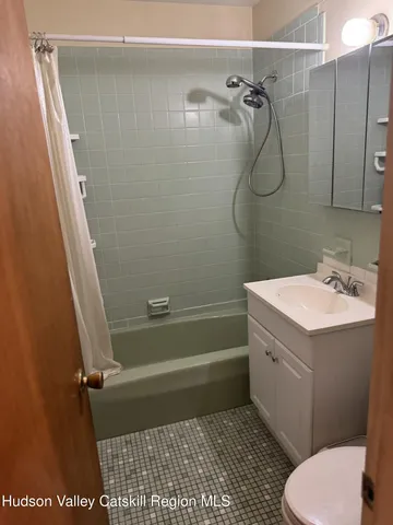 a bedroom with a bed and a fireplace