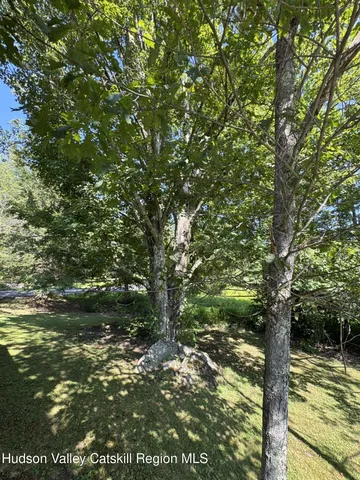 a bird view of a house with a yard