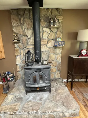 a view of a livingroom with furniture and a fireplace