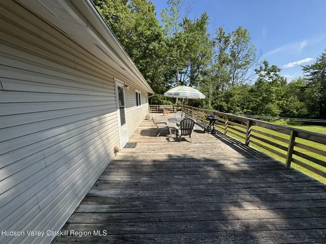 a bedroom with a bed next to a window