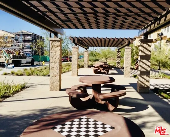 a table and chairs in front of a building