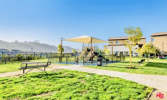 a view of a swimming pool and a yard